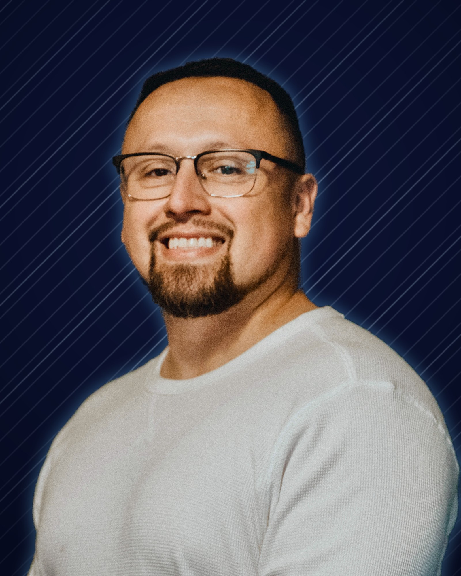 DJ LS (Juan Zafra) headshot on a navy and chrome background