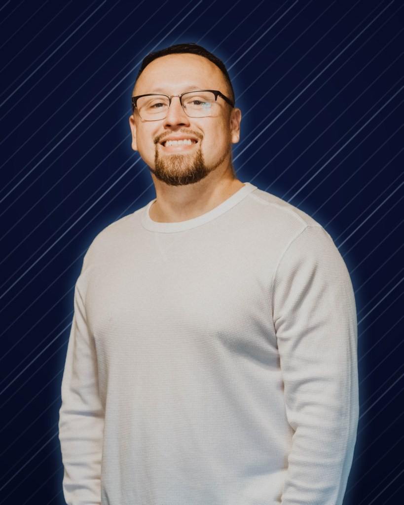 DJ LS (Juan Zafra) on a navy and chrome background